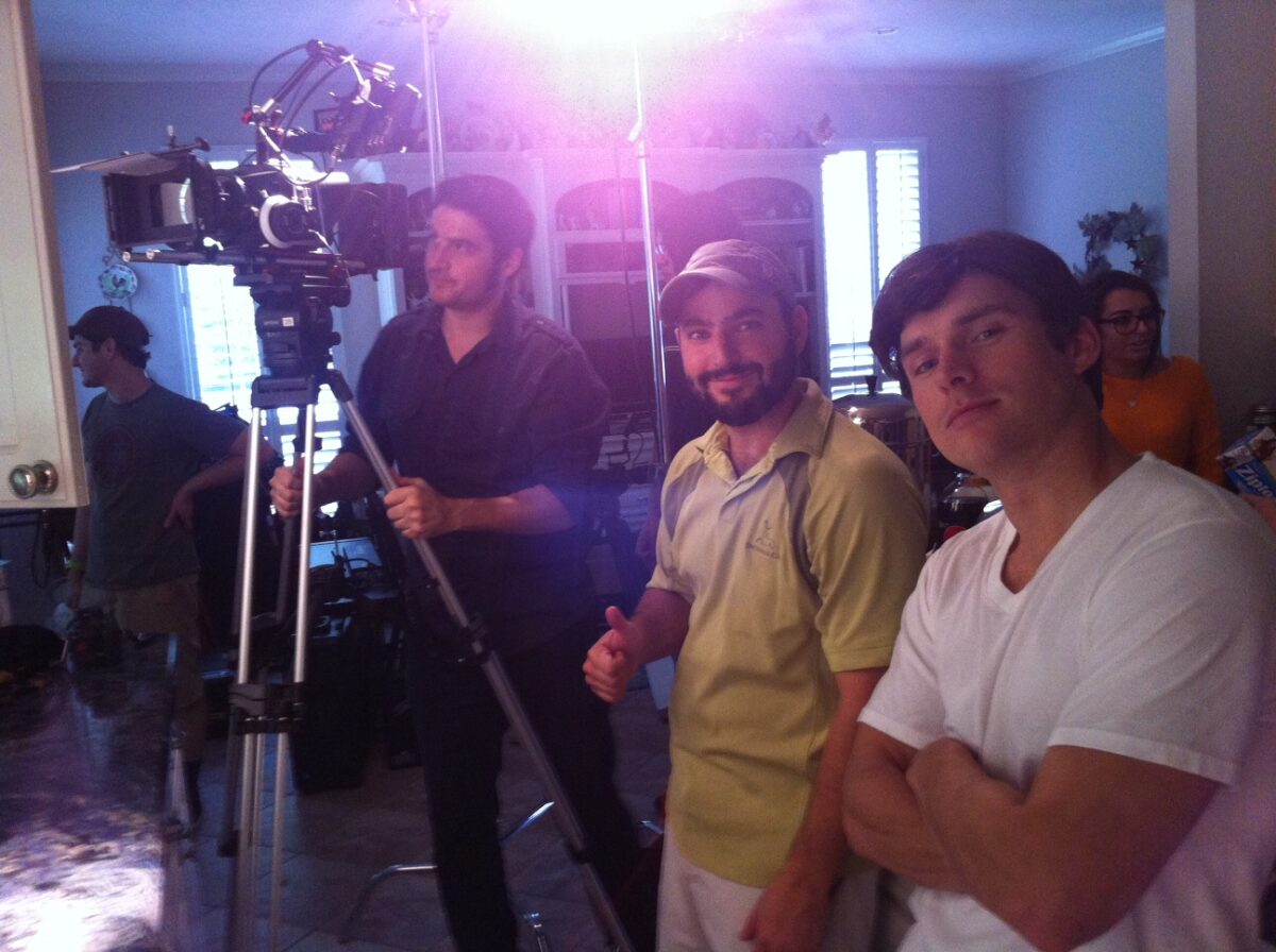 The production crew striking a pose while filming reenactments for 