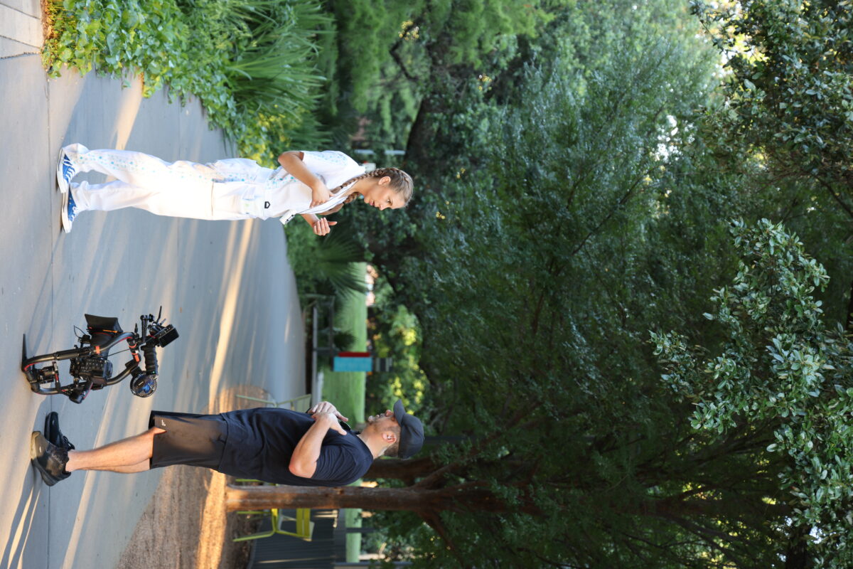 Cinematographer, Scott Marett, discussing his next series of shots with the talent