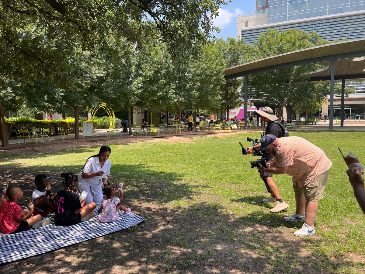 Troy Fields and Esteban Valencia filming with the WaterWipes Clean Team