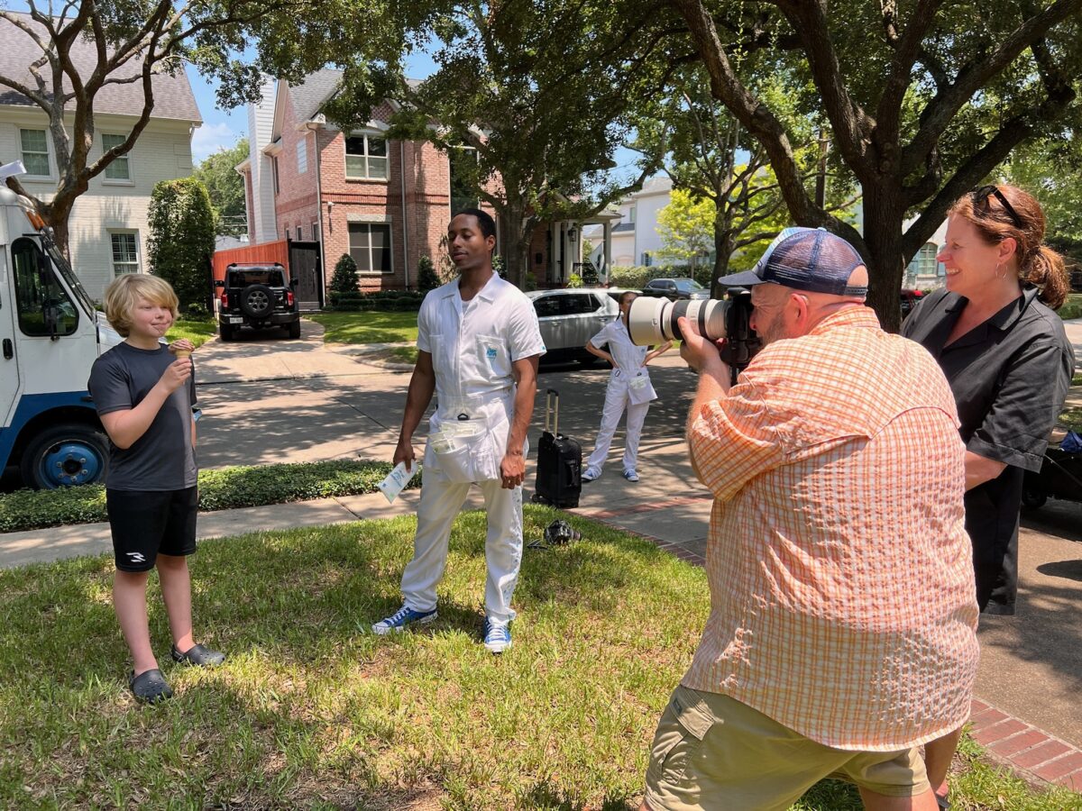 Troy Fields capturing photos with the WaterWipes Clean Team