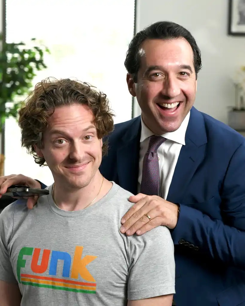 Adam Funk posing with Funk Law Group team member on set
