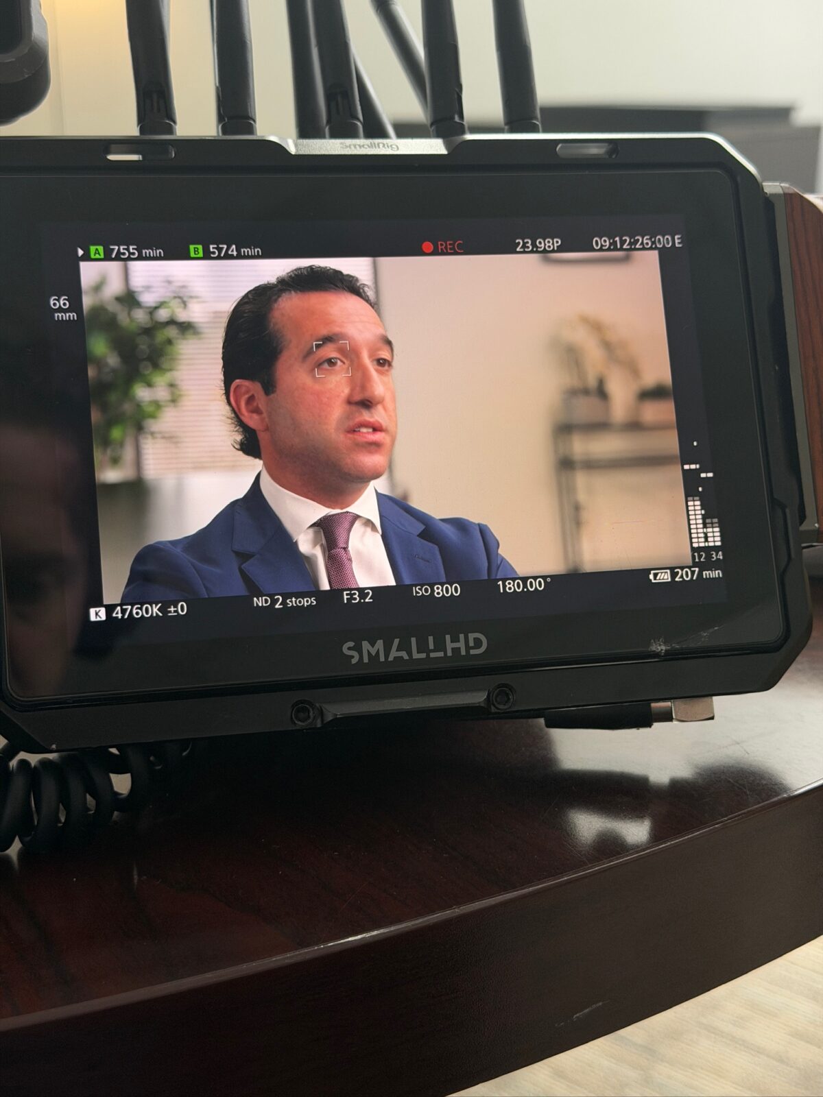 Production monitor close-up of Adam Funk interview footage