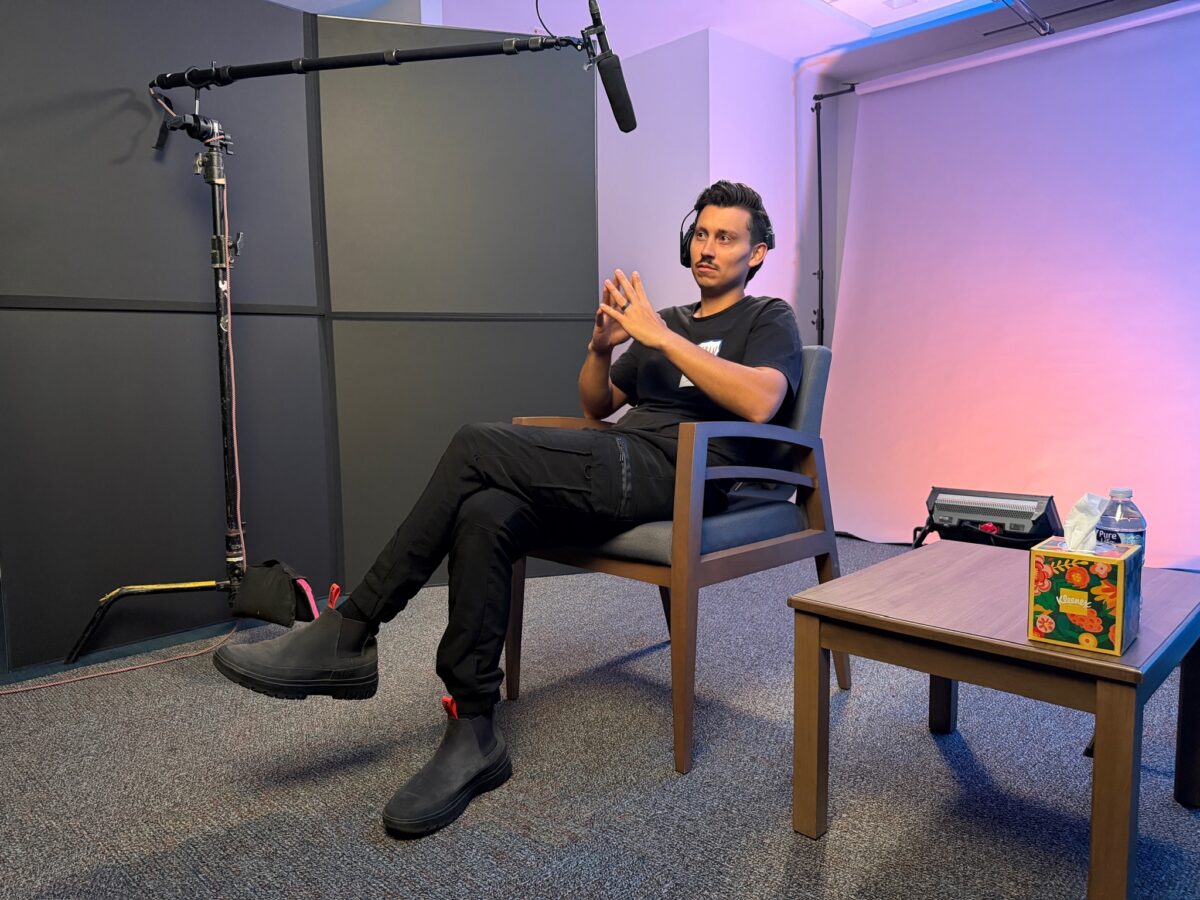 Esteban Valencia sitting in an interview set up for a project for Rice University's Kinder Institute for Urban Research