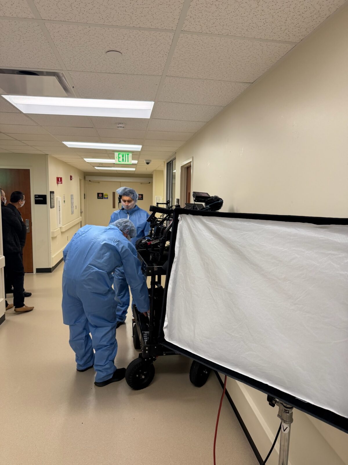 The film crew suits up to start filming in the Operating Room at LBJ Hospital in Houston, Texas