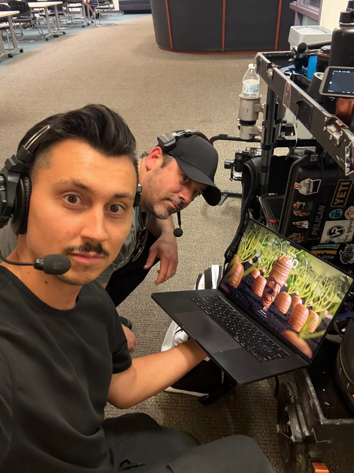 Scott Marett and Esteban Valencia proudly show a new wallpaper they added to Zach Jankovic's Computer